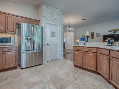 Welcome to this LOVELY LILAC DESIGNER HOME with a GOLF CART on Bella Glade Country Club in Florida - for sale on GolfHomes.com, golf home, golf lot