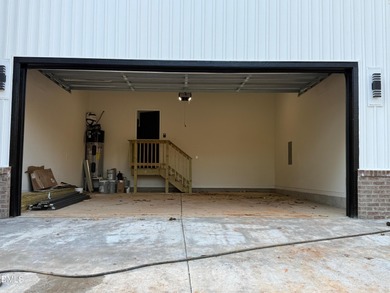 Stunning modern new construction in the gated lake community of on River Golf and Country Club at Lake Royale in North Carolina - for sale on GolfHomes.com, golf home, golf lot