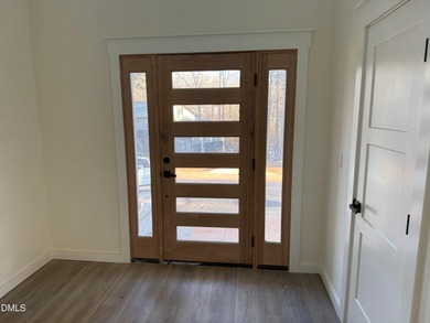 Stunning modern new construction in the gated lake community of on River Golf and Country Club at Lake Royale in North Carolina - for sale on GolfHomes.com, golf home, golf lot