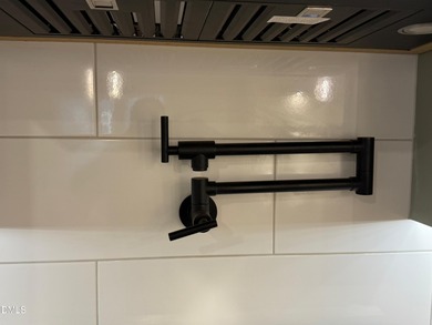 Stunning modern new construction in the gated lake community of on River Golf and Country Club at Lake Royale in North Carolina - for sale on GolfHomes.com, golf home, golf lot