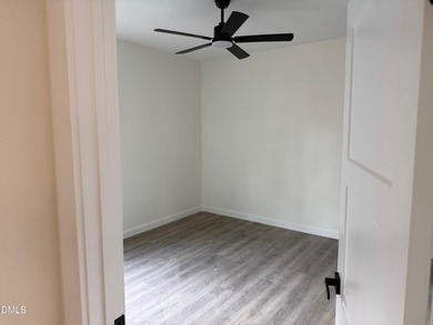 Stunning modern new construction in the gated lake community of on River Golf and Country Club at Lake Royale in North Carolina - for sale on GolfHomes.com, golf home, golf lot