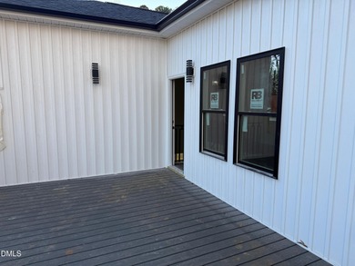 Stunning modern new construction in the gated lake community of on River Golf and Country Club at Lake Royale in North Carolina - for sale on GolfHomes.com, golf home, golf lot