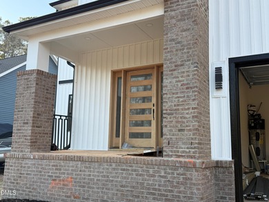 Stunning modern new construction in the gated lake community of on River Golf and Country Club at Lake Royale in North Carolina - for sale on GolfHomes.com, golf home, golf lot