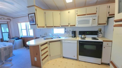 ENJOY THE WATER VIEW FROM THIS TWO BEDROOM 1 1/2 BATH MOBILE on River Run Golf Links in Florida - for sale on GolfHomes.com, golf home, golf lot