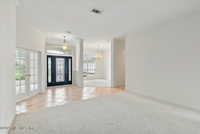 LOCATION, LOCATION - LOVELY MARSH VIEW HOME LOCATED IN THE on Queens Harbour Yacht and Country Club in Florida - for sale on GolfHomes.com, golf home, golf lot