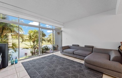 Stunning 3-level with breathtaking golf course and water views on Country Club of Miami in Florida - for sale on GolfHomes.com, golf home, golf lot