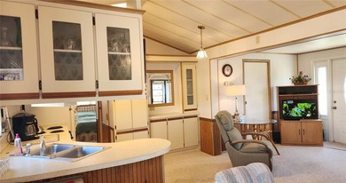 ENJOY THE WATER VIEW FROM THIS TWO BEDROOM 1 1/2 BATH MOBILE on River Run Golf Links in Florida - for sale on GolfHomes.com, golf home, golf lot