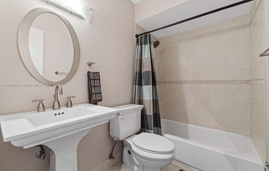 Stunning 3-level with breathtaking golf course and water views on Country Club of Miami in Florida - for sale on GolfHomes.com, golf home, golf lot