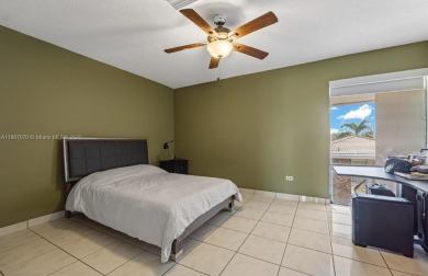 Stunning 3-level with breathtaking golf course and water views on Country Club of Miami in Florida - for sale on GolfHomes.com, golf home, golf lot