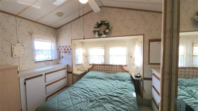 ENJOY THE WATER VIEW FROM THIS TWO BEDROOM 1 1/2 BATH MOBILE on River Run Golf Links in Florida - for sale on GolfHomes.com, golf home, golf lot