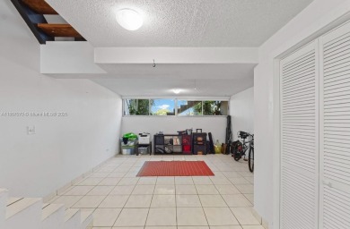 Stunning 3-level with breathtaking golf course and water views on Country Club of Miami in Florida - for sale on GolfHomes.com, golf home, golf lot