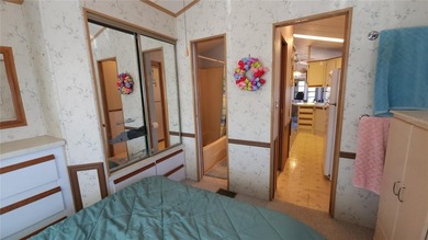 ENJOY THE WATER VIEW FROM THIS TWO BEDROOM 1 1/2 BATH MOBILE on River Run Golf Links in Florida - for sale on GolfHomes.com, golf home, golf lot