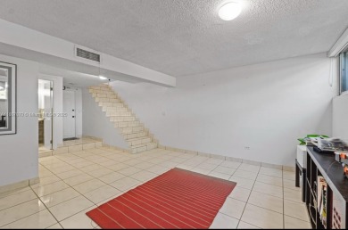 Stunning 3-level with breathtaking golf course and water views on Country Club of Miami in Florida - for sale on GolfHomes.com, golf home, golf lot