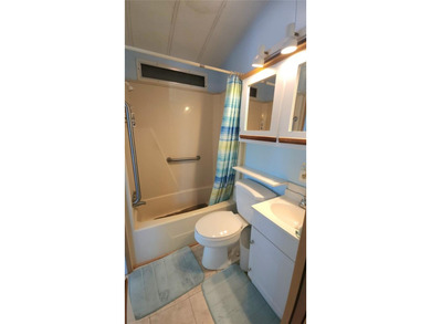 ENJOY THE WATER VIEW FROM THIS TWO BEDROOM 1 1/2 BATH MOBILE on River Run Golf Links in Florida - for sale on GolfHomes.com, golf home, golf lot