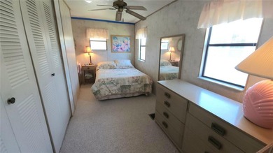 ENJOY THE WATER VIEW FROM THIS TWO BEDROOM 1 1/2 BATH MOBILE on River Run Golf Links in Florida - for sale on GolfHomes.com, golf home, golf lot