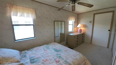 ENJOY THE WATER VIEW FROM THIS TWO BEDROOM 1 1/2 BATH MOBILE on River Run Golf Links in Florida - for sale on GolfHomes.com, golf home, golf lot