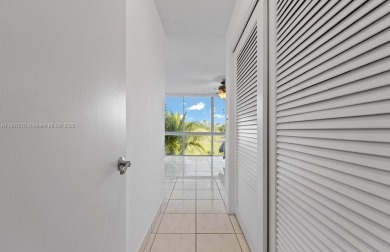 Stunning 3-level with breathtaking golf course and water views on Country Club of Miami in Florida - for sale on GolfHomes.com, golf home, golf lot