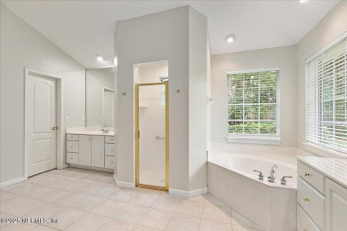 LOCATION, LOCATION - LOVELY MARSH VIEW HOME LOCATED IN THE on Queens Harbour Yacht and Country Club in Florida - for sale on GolfHomes.com, golf home, golf lot