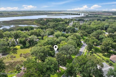 LOCATION, LOCATION - LOVELY MARSH VIEW HOME LOCATED IN THE on Queens Harbour Yacht and Country Club in Florida - for sale on GolfHomes.com, golf home, golf lot