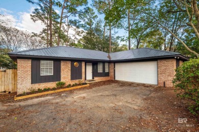 Welcome to 107 Tibidow Circle, a beautifully updated 3-bedroom on Lake Forest Yacht and Country Club in Alabama - for sale on GolfHomes.com, golf home, golf lot