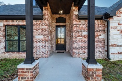 Only a year old, this gorgeous and high quality construction 4 on Wolf Ridge Golf Course in Oklahoma - for sale on GolfHomes.com, golf home, golf lot