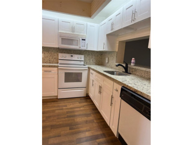 Welcome home to this stunning 2-bedroom, 2-bathroom FIRST FLOOR on Flamingo Lakes Country Club in Florida - for sale on GolfHomes.com, golf home, golf lot