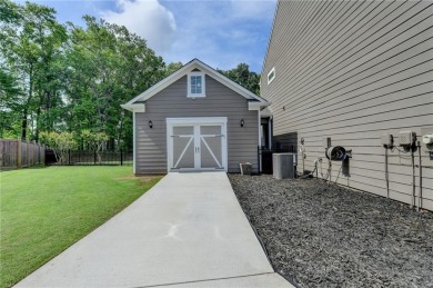 Nestled in a serene cul-de-sac, this meticulously maintained on Reunion Golf Club in Georgia - for sale on GolfHomes.com, golf home, golf lot