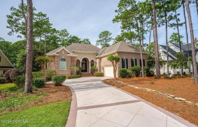 A home built for comfort and entertaining awaits you.  The front on Ocean Ridge Plantation in North Carolina - for sale on GolfHomes.com, golf home, golf lot