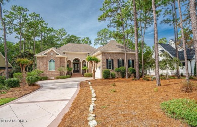 A home built for comfort and entertaining awaits you.  The front on Ocean Ridge Plantation in North Carolina - for sale on GolfHomes.com, golf home, golf lot