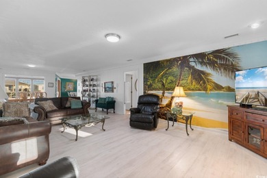 This fully furnished, spacious 4-bedroom, 3-bath raised beach on Beachwood Golf Club in South Carolina - for sale on GolfHomes.com, golf home, golf lot