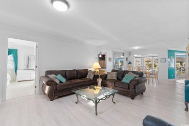 This fully furnished, spacious 4-bedroom, 3-bath raised beach on Beachwood Golf Club in South Carolina - for sale on GolfHomes.com, golf home, golf lot