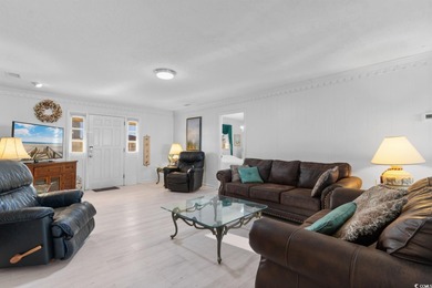 This fully furnished, spacious 4-bedroom, 3-bath raised beach on Beachwood Golf Club in South Carolina - for sale on GolfHomes.com, golf home, golf lot