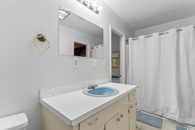 This fully furnished, spacious 4-bedroom, 3-bath raised beach on Beachwood Golf Club in South Carolina - for sale on GolfHomes.com, golf home, golf lot