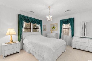This fully furnished, spacious 4-bedroom, 3-bath raised beach on Beachwood Golf Club in South Carolina - for sale on GolfHomes.com, golf home, golf lot