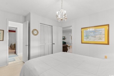 This fully furnished, spacious 4-bedroom, 3-bath raised beach on Beachwood Golf Club in South Carolina - for sale on GolfHomes.com, golf home, golf lot