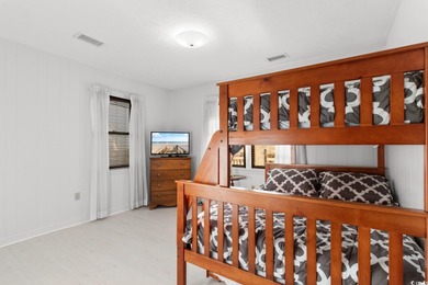 This fully furnished, spacious 4-bedroom, 3-bath raised beach on Beachwood Golf Club in South Carolina - for sale on GolfHomes.com, golf home, golf lot