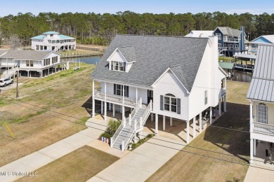 This Remarkable Waterfront home in Pass Christian's popular on Pass Christian Isles Golf Club in Mississippi - for sale on GolfHomes.com, golf home, golf lot