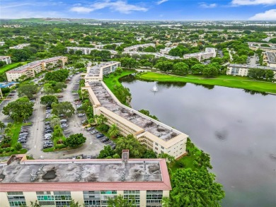 Exquisite water view 2 bed/2 bath unit. No assesments/40 Yr DONE on Wynmoor Golf Course in Florida - for sale on GolfHomes.com, golf home, golf lot