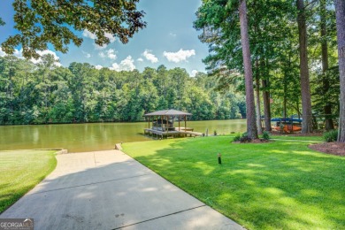 Lakefront Home on Large Level Lot with Covered Dock on Turtle Cove Golf Course in Georgia - for sale on GolfHomes.com, golf home, golf lot