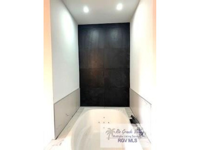 Luxury living in paradise! Located on prestigious Laguna Madre on South Padre Island Golf Club in Texas - for sale on GolfHomes.com, golf home, golf lot