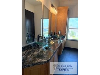 Luxury living in paradise! Located on prestigious Laguna Madre on South Padre Island Golf Club in Texas - for sale on GolfHomes.com, golf home, golf lot