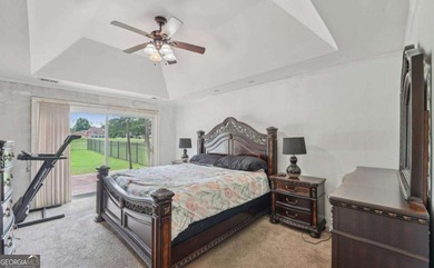 Welcome home to this beautiful all-brick ranch in the on Canongate At Georgia National Golf Club in Georgia - for sale on GolfHomes.com, golf home, golf lot