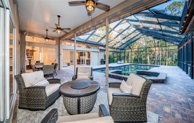 Under contract-accepting backup offers. A stunning ensemble of on Tarpon Woods Golf Club in Florida - for sale on GolfHomes.com, golf home, golf lot