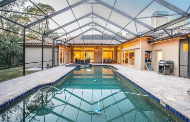 Under contract-accepting backup offers. A stunning ensemble of on Tarpon Woods Golf Club in Florida - for sale on GolfHomes.com, golf home, golf lot