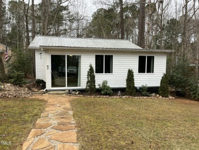 This beautiful 2-bedroom, 2-bathroom home is located in the on River Golf and County Club at Lake Royale in North Carolina - for sale on GolfHomes.com, golf home, golf lot