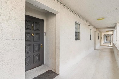 Enjoy the scenic garden view in this beautifully updated on Inverrary Country Club in Florida - for sale on GolfHomes.com, golf home, golf lot