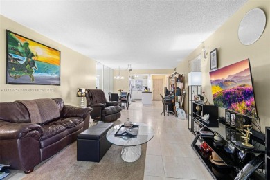 Enjoy the scenic garden view in this beautifully updated on Inverrary Country Club in Florida - for sale on GolfHomes.com, golf home, golf lot