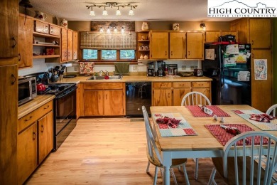 Cute Year Round Mountain Cabin.  Open floor plan with fantastic on Land Harbor Golf Course in North Carolina - for sale on GolfHomes.com, golf home, golf lot