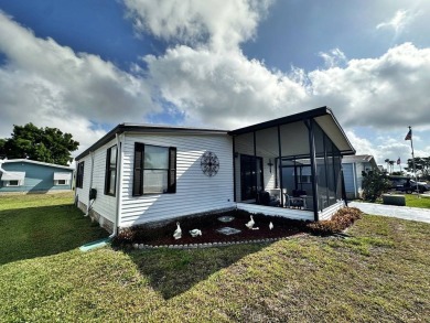 Welcome to your perfect retreat! This cozy 2 bedroom, 1 bathroom on Lake Henry Golf Club in Florida - for sale on GolfHomes.com, golf home, golf lot