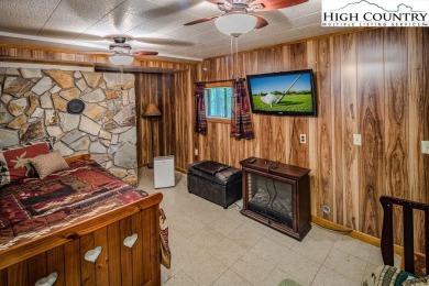 Cute Year Round Mountain Cabin.  Open floor plan with fantastic on Land Harbor Golf Course in North Carolina - for sale on GolfHomes.com, golf home, golf lot